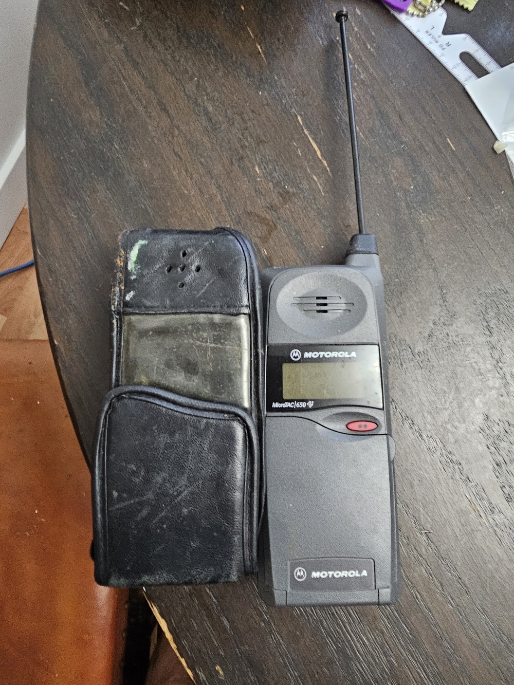 Motorola brick cell phone in charcoal gray and black